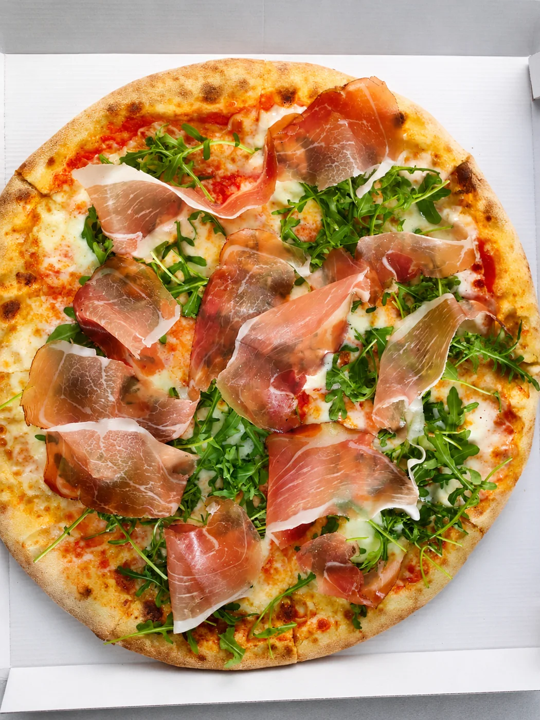 Pizza con prosciutto crudo e rucola di Pizzeria Cavaliere